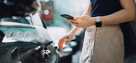 Woman planning fuel stops on her mobile phone.