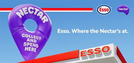 Esso station canopy with a purple nectar pin on top to show where you can collect & spend nectar points.